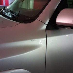 Anyone know what to do about this? Its a small scratch and really the only flaw on the vehicle. It's very deep.