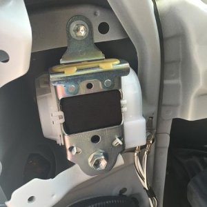 Step 13:  Remove the lower and then upper bolts of the belt retraction unit and then remove the unit and the belt.