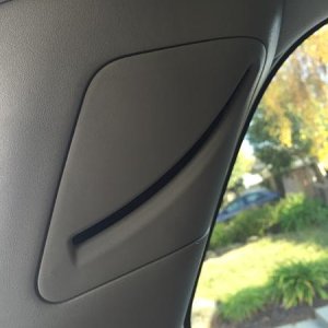 Step 8: Pry off the upper seat belt access cover.