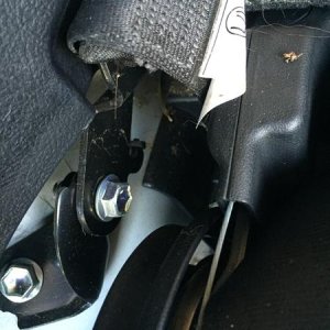 Step 6:  Identify the lower seat belt anchor bolt. This is the left side. The right side bolt is not on the side, it faces the back and may need an im