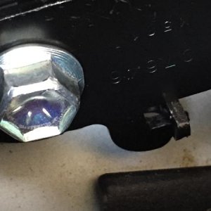 Step 16:  Install the lower belt support making sure the hook is under the protrusion.