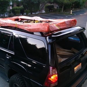 I broke down the box at the UPS freight pickup location and strapped it to the stock roof rack