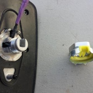 Retaining nut removed.