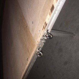 Eye hooks for holding down folding section