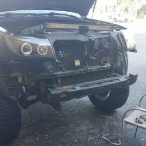 Tearing her down to put the new bumper on.