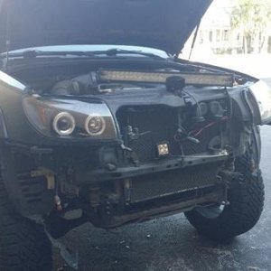 Tearing her down to put the new bumper on.