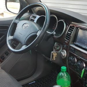 Wheel angle of interior for perception. Retro batman emblems on upper door panel.