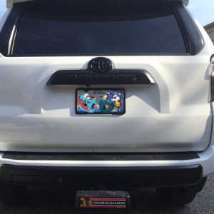 Painted rear Toyota badge, 4Runner badge, and bumper valance matte black. Added Blackhawks hitch cover bump step