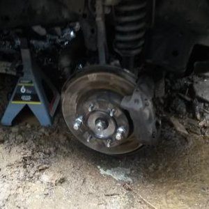 After reassembly, my hub was this close to the ground. Dug a hole and put the wheel back on!