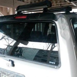 I replaced the glass the next day, but the dent remains with some primer and I removed the spoiler since it was only half attached.