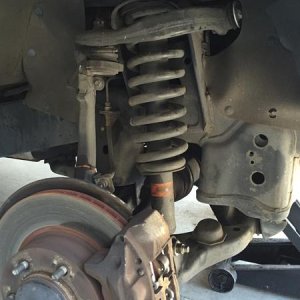 I removed the the strut castle nut but not the 3 strut mount nuts then made marks on the eccentric washer on all 4 lower control arm bolts. Removed th