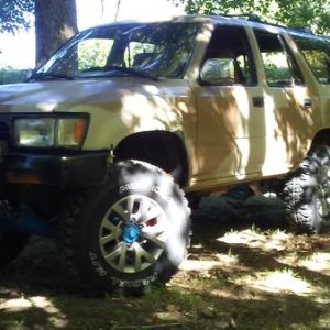 sitting on sticker Cooper Mud Claw MT Radials and 2013 Sequoia Alloys