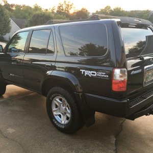 Bedliner spray on previously rusting chrome bumper, trim/vinyl black spray on plastic trim that snaps into top of bumper. Looks awesome.