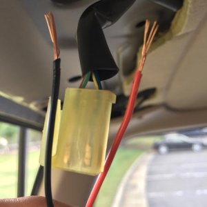 Positive cable tapped into the Blue/Yellow cable.  Negative cable tapped into the Green/Red cable.