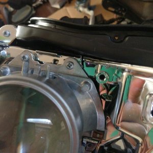 there is a crack here.  you can kinda see it.  I'm going to epoxy it and hope it holds.  I don't have the $ to buy a new headlight.