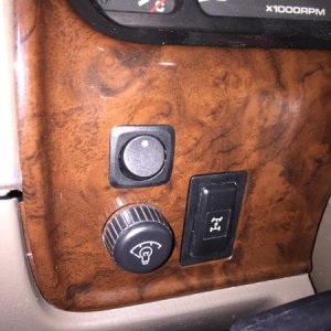 Drilled 3/4" hole above the dash light level knob.  Pushed the switch on through, and tightened it down on the back.