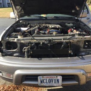 Old headlights and grille off, about to put on the new.