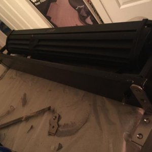 The aluminum base, coated in truck bed liner, with the L-brackets on the back.