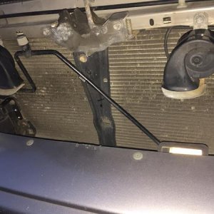 The metal L-brackets cut to accept the light bar.  The mounting position on the passenger side is about half an inch lower that the driver side.  You'