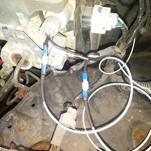 Tapped into the red wire on the sensor with spade connectors then used heat shrink to help keep it clean. Wrapped it all in weather resistant electric
