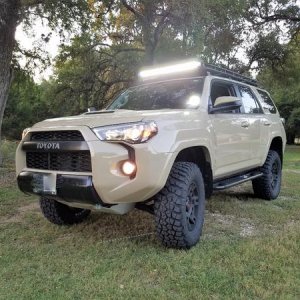 With new BFG 285/70/R17's and Rigid Radiance Light bar mounted to Gobi rack.  It also shows the 2.5 inch lift with OME BP-51s all around.