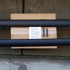 Initally bought OEM crossbars, but they didn't work. Thule box couldn't clear the shark fin.