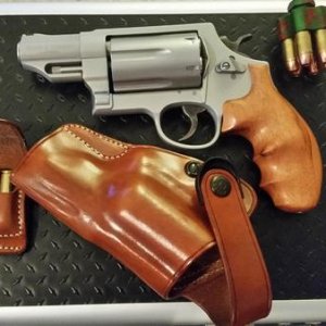 Here is my whole ensemble for my Governor; hogue wood grips, Galco Holster and ammo carrier, 5 Star Speed loader (zombie green).