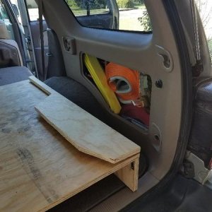 Hinged wing for side storage access
