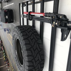 Matching spare and Hi-Lift mounted on the roof rack.
