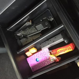 Center console tray fitting over lock box