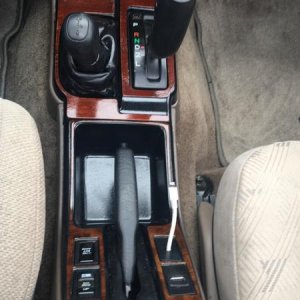 New center console 
Gear shift bezel is SR5 wood restained