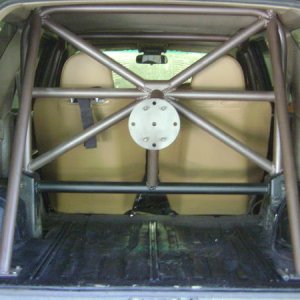 Rear portion of cage. C & D pillars, diagonal bracing, harness bars and spare tire mount.