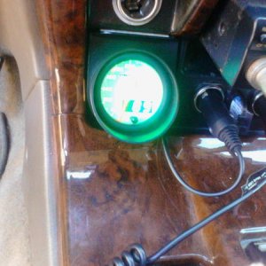 Lights up green. It's hard to get a good pic during the day. Looks sweet at night.  Also has dimmer wire with 3 settings. I didn't hook mine up.  Real