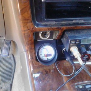 Glowshift Max Tow Trans temp gauge installed in use-less cubby hole. Actually fits perfect. Drill couple small holes in back of cubby hole for wire to