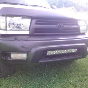 Factory Toyota grill Plasti dipped black. Bug guard Plasti dipped black due to fading and looking like hell.