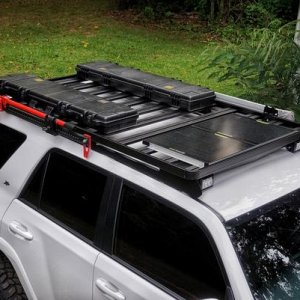 Front runner slimline II with dual cargo boxs, goal zero boulder30 solar panels, hi-lift jack, and Foxwing Awning 2.1