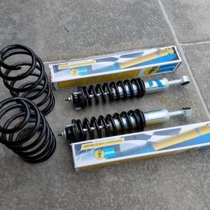 Bilstein 6112 and 5160 shocks, with Wheeler T13 rear springs.