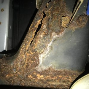 Rust hole at weld seam. Rear frame rail attaches to siderail