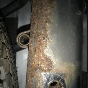 Scaling rust all over rear frame rail that runs past the spare tire. Same rail doubles as a hitch mount for receiver. The sub hitch bar cost $800.00 &