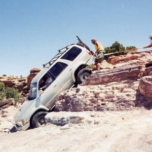 Behind the Rocks trail near Moab Utah. The obstacle is White Knuckle Hill. The guy standing at my rear bumper was my spotter. It was standard to put a