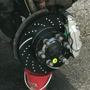Close-up of EBC Rotors and Toyota oem Tundra caliper mounted.  EBC green pads matched to rotors.