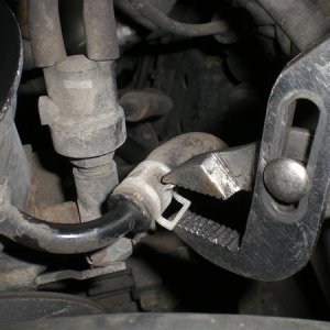 Clamping the hose fastener.