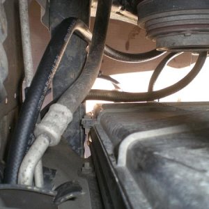 Routed the hoses through the bulkhead separating the front of the a/c condenser to the engine bay.
