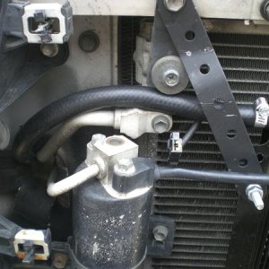 Top hose goes back to the transmission.