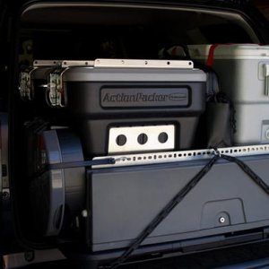 Storage drawer is bolted to OEM sliding cargo deck and can slide out