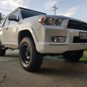 Different angle of the front bumper and a look at my modified nfab steps.