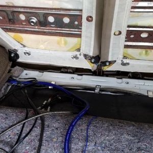Slit in the carpet to come up the rear of the seat to show less wire.