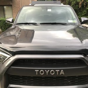 Aukey DR02 Dashcam installed next to rear view mirror mount, passanger side. Barely visible.