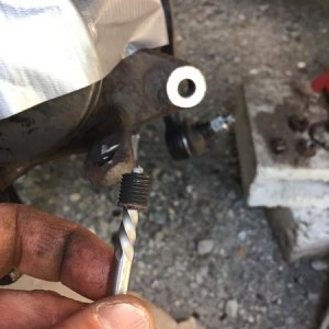 The broken bolt from the lower ball joint that was stuck in the knuckle. Many days of frustration, all for this little piece of shit.