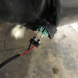 Testing the polarity before attaching the connector to the Morimoto fog lights.